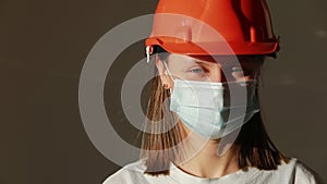 Portrait of professional architect engineer woman in medical protective mask, businesswoman business people in hard hat