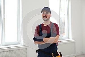 Portrait of professional construction worker with tool belt