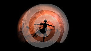 Portrait of professional dance artist. Beautiful girl ballet dancer performing pirouette on red full moon isolated on