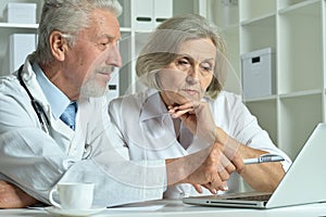 Portrait of professional doctors working in cabinet