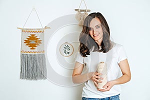 Portrait of a professional girl in macrame weaving