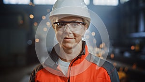 Portrait of a Professional Heavy Industry Engineer Worker Wearing Uniform, Glasses and Hard Hat in