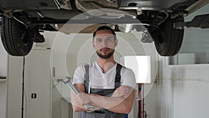 Portrait professional mechanic, repair station, auto repairman standing