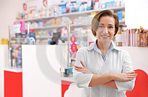 Portrait of professional pharmacist in modern drugstore