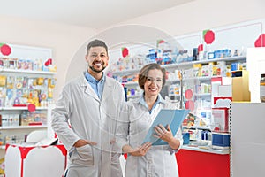 Portrait of professional pharmacists in drugstore