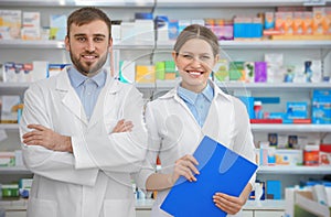 Portrait of professional pharmacists in drugstore