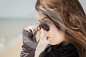 Portrait in profile of a pretty teenage girl