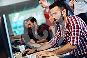 Portrait of programmers working in development software company