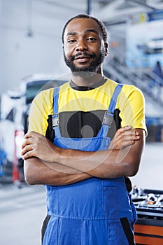 Portrait of proud car service expert