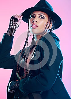 Portrait, punk and fashion with woman, heavy aesthetic metal and girl against a pink studio background. Face, female