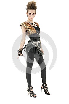 Portrait of punk woman with attitude gesturing rock & roll sign over white background photo