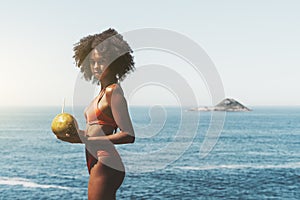 A mixed young woman on the beach