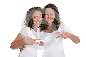 Portrait of real twin sisters isolated over white.