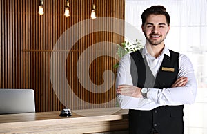 Portrait of receptionist at desk