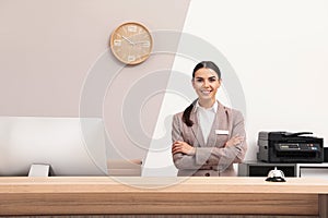 Portrait of receptionist at desk in hotel