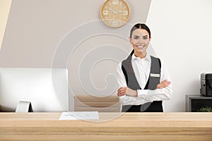 Portrait of receptionist at desk in hotel