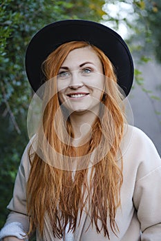 Portrait of a red-haired beautiful young girl