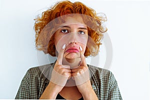 portrait red-haired teenage girl with emotions on face