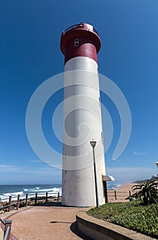 Portrait Red and White Lighthouse on Coastal Landscape