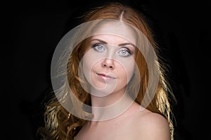 Portrait of a redhead female model