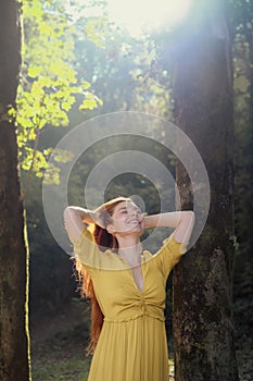 Portrait Of Redhead Young Woman Holding Hair