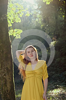 Portrait Of Redhead Young Woman Holding Hair