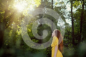 Portrait Of Redhead Young Woman Looking At Sun