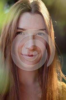 Portrait Of Redhead Young Woman Smiling At Camera