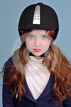 Portrait of redheaded girl jockey