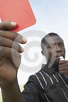 Portrait Of A Referee Showing Red Card
