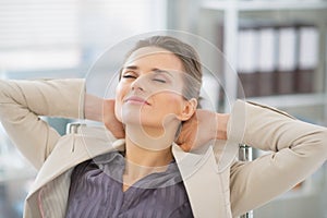 Portrait of relaxed business woman in office