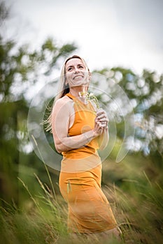 Portrait of a relaxed middle aged woman outdoors