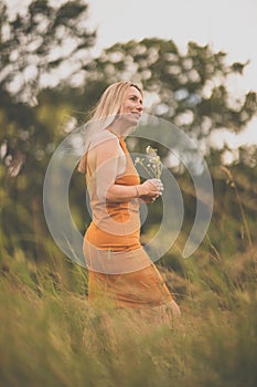 Portrait of a relaxed middle aged woman outdoors