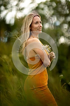 Portrait of a relaxed middle aged woman outdoors