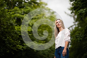 Portrait of a relaxed middle aged woman outdoors