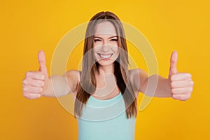 Portrait of reliable adorable sweet lady raise thumbs up beaming smile on yellow background