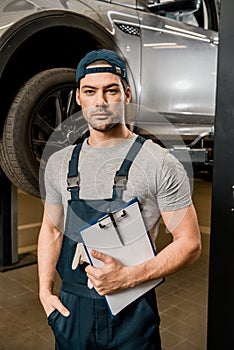 portrait of repairman with notepad