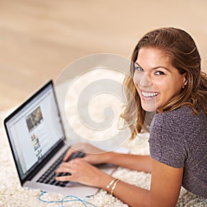 Portrait, research or happy woman on laptop in house to relax for streaming film, video or movie online. Smile, website