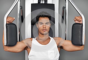 Portrait, resistance exercise and man in gym for arm muscle training for health, wellness and strength. Fitness, body