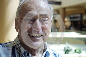 Portrait of a retired old man smiling