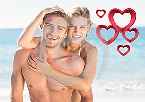 Portrait of romantic couple embracing on beach