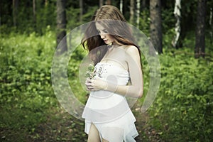 Portrait of romantic woman at fairy forest