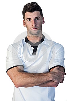 Portrait of rugby player with arms crossed