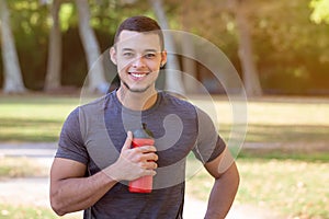 Portrait runner smiling young latin man running jogging sports training fitness workout copyspace copy space