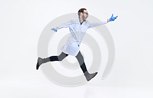 Portrait of running man, chemist, doctor in action and motion isolated on white background. Concept of healthcare