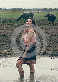 Portrait of rural women wear Thai dress with buffalo