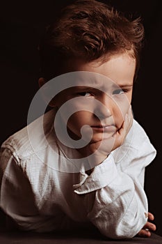 portrait of a sad angry child preschooler boy