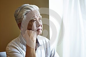 Portrait sad asian senior man
