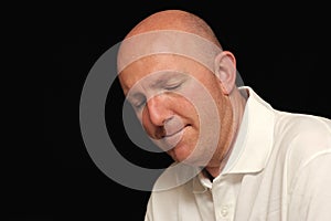 Portrait of sad bald man