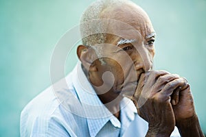 Portrait of sad bald senior man